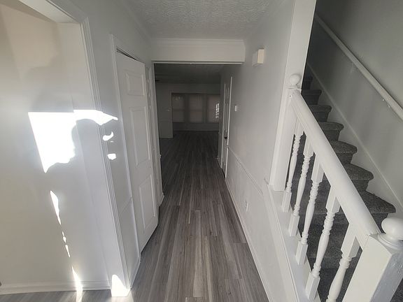 Step inside to freshly painted walls and stunning new floors that set the tone for this updated home. The kitchen sits to your left, while stairs to the right lead to spacious upstairs bedrooms. Bright, clean, and move-in ready!