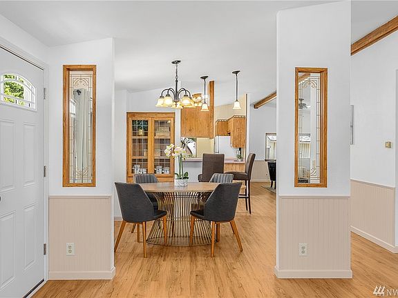 Formal dining area off kitchen with built-in display cabinetry and shelving for your treasured pieces.