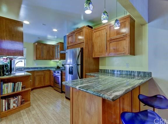 Totally updated kitchen with wall removed to open up kitchen to the rest of the living space - very 