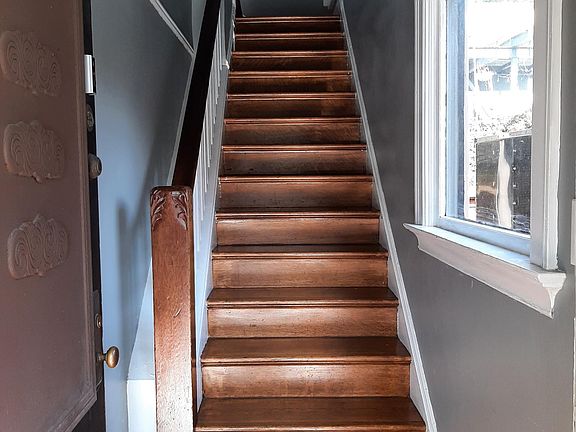 Front door entrance and stairway to second floor apartment