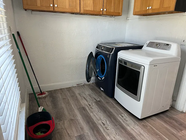 Laundry Room with Washer and Dryer next to Kitchen