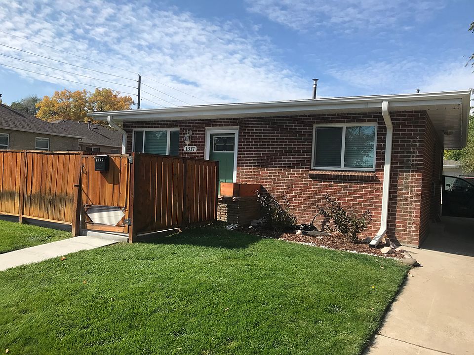 A large grassy yard shared with the other four units. Owner maintains the yard.