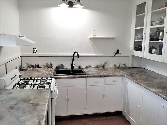 New custom eating bar and countertops with whimsical backsplash