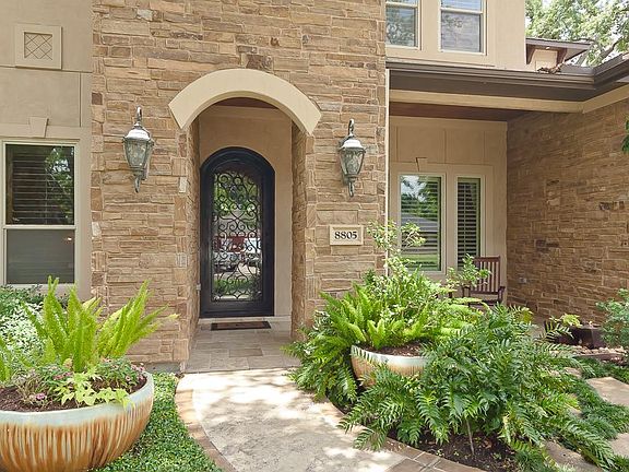 Stunning iron front door and front porch.