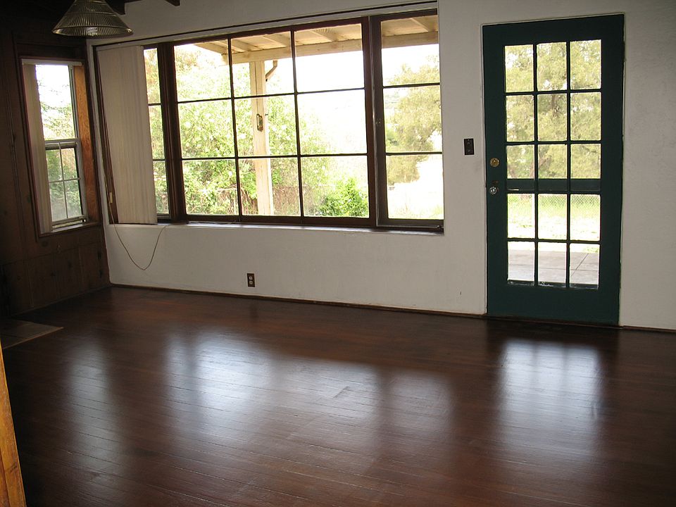 Living room, windows/door to covered front porch.