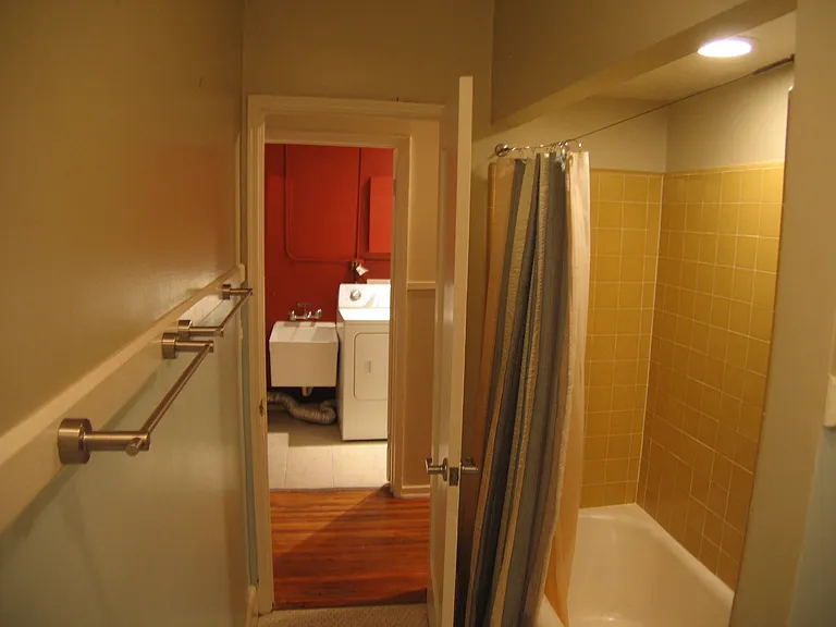 Bathroom in 200 facing hallway and laundry.
