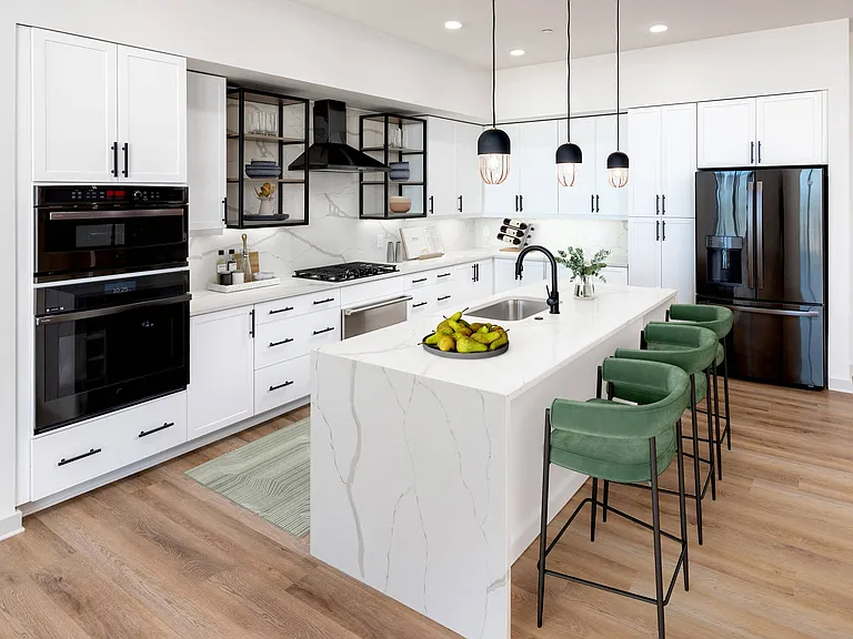 Luxe Penthouse Kitchen with Waterfall Quartz Counters and Upgraded Appliances