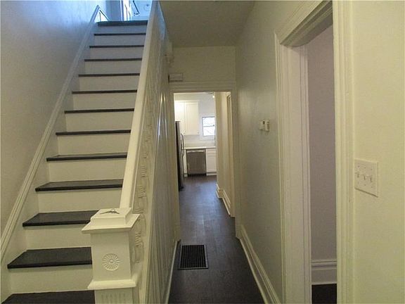 A wonderful entrance into the home. Long hallway to kitchen gives you an even better idea to the ful