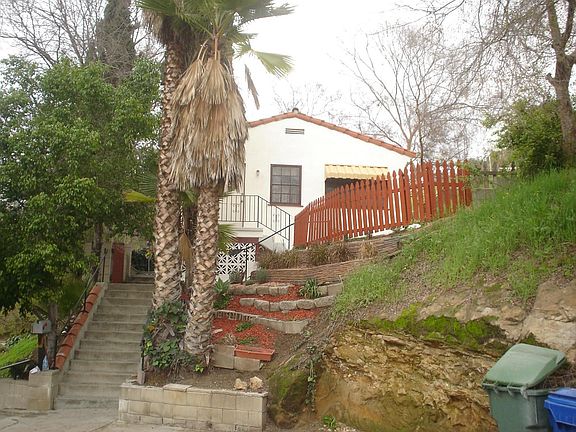 Remodeled and Cute with small yard and large hillside for your gardens.