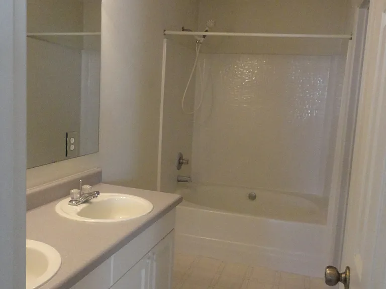 Master bath with garden tub, private toilet room, and walk in closet.