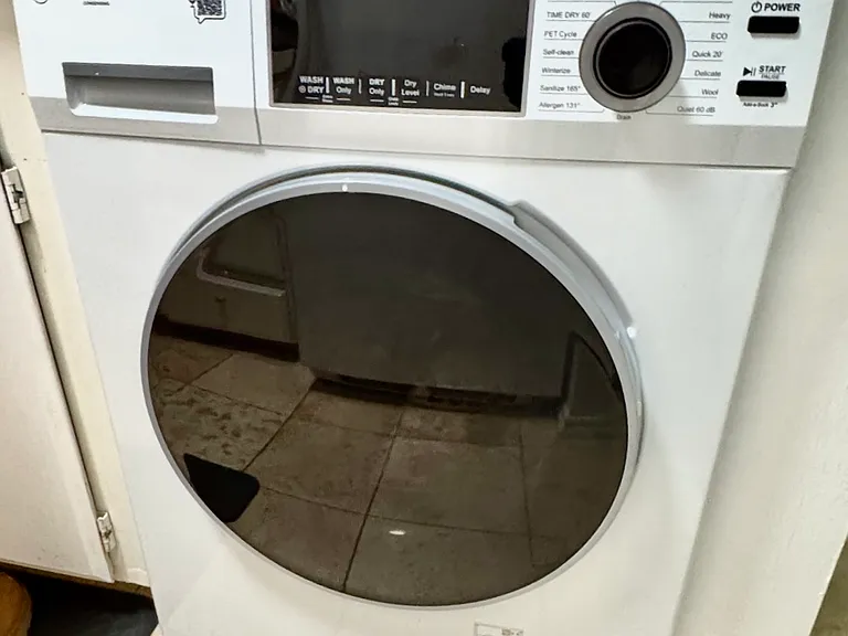 Newly installed Washer/Dryer Combo. Building has a card operated laundry.