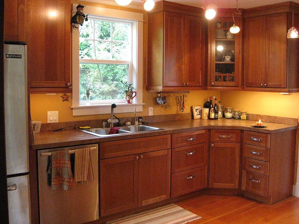 Kitchen window overlooks private garden area.
