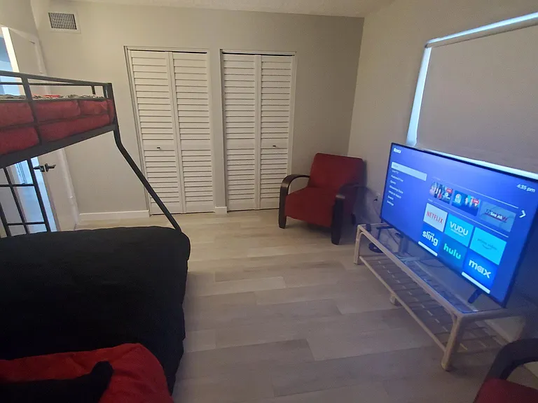 2 large closets, 65 inch smart TV and 3 beds