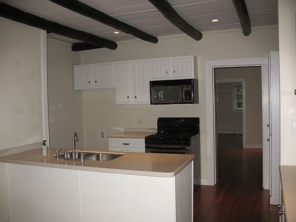 Totally modern kitchen with solid surface countertops.