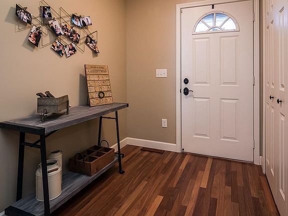 Welcome home! Step onto the very durable Teak hardwood flooring, with convenient front entry closet nearby.