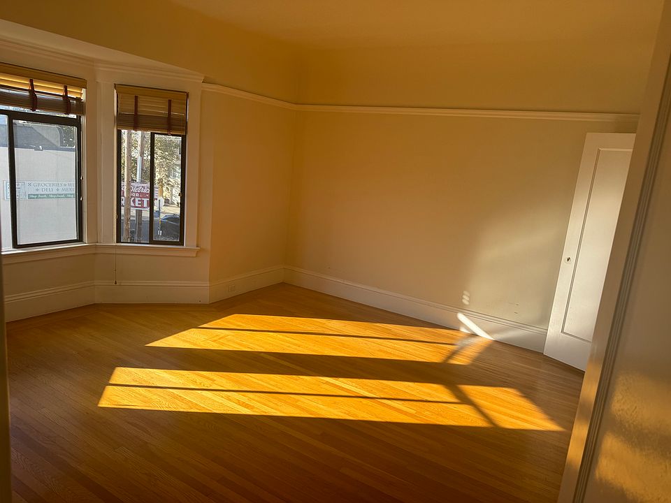 The master bedroom with the door to the walk-in closet on the right. The second closet is concealed by the entry door in the foreground.