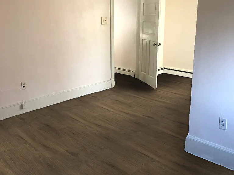 Bedroom with two windows, two large closets, and bathroom