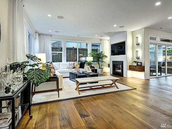 Great room adjoining kitchen and with access to covered patio. Photo not of actual home - may contain optional features.