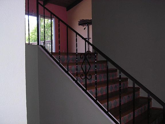 Beautifully tiled stairway leading to the great room. Where you can walk onto the upper deck.