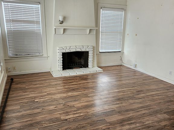 Walking into living room. Fireplace is just for show. Does not work.
