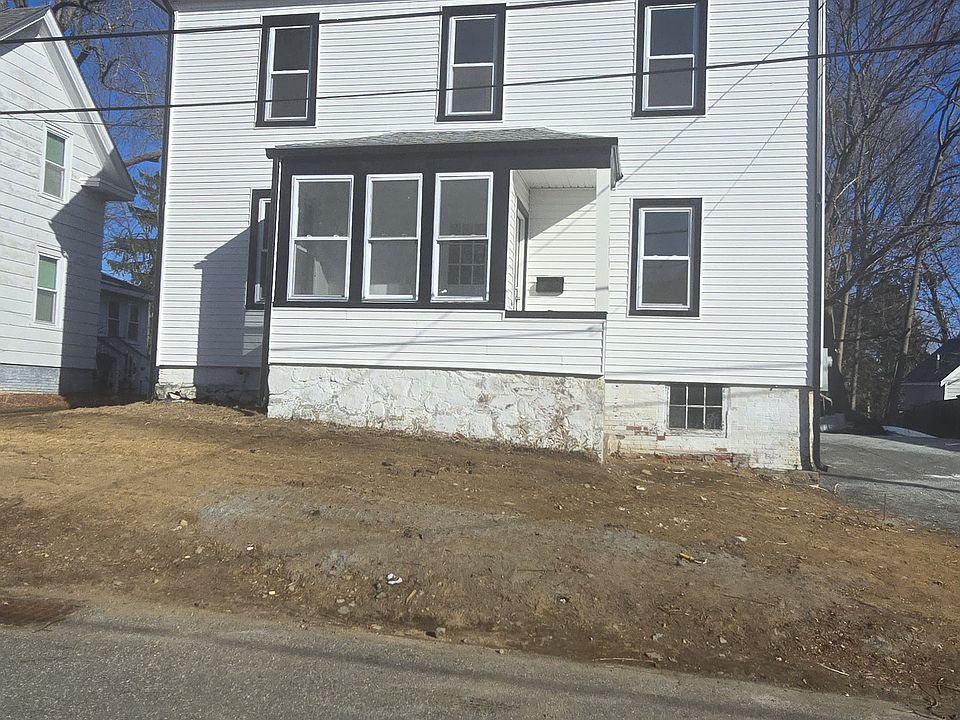 Paver driveway and lawn in spring.