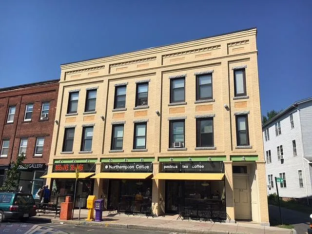 Apartment is the entire second floor of windows in the yello