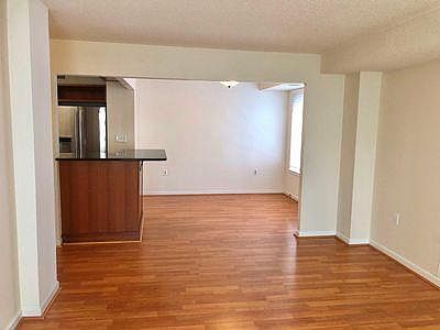 Dining room off of living room and open kitchen with serving bar