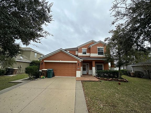 Front view of home. trash and recycle included.