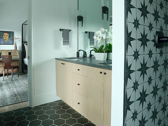 bathroom with large walk-in shower and 2 sinks