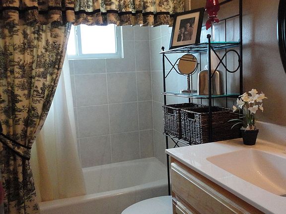 Bathroom with tile shower and tub