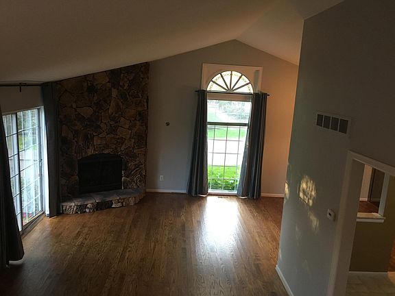 Living room with gas fireplace and patio wall door