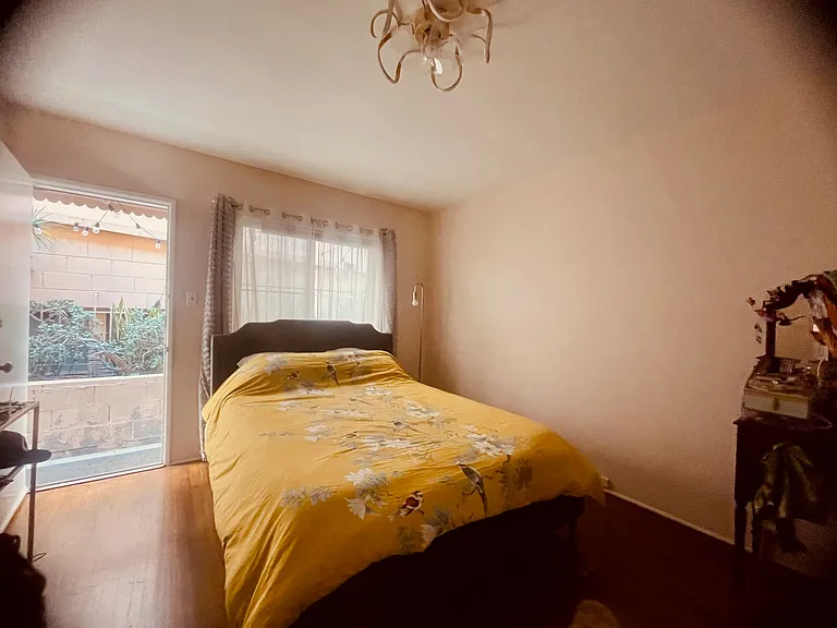 Lovely, large bedroom with a separate entrance leading to a cute patio