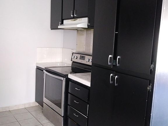 Kitchen with newer Whirlpool stove