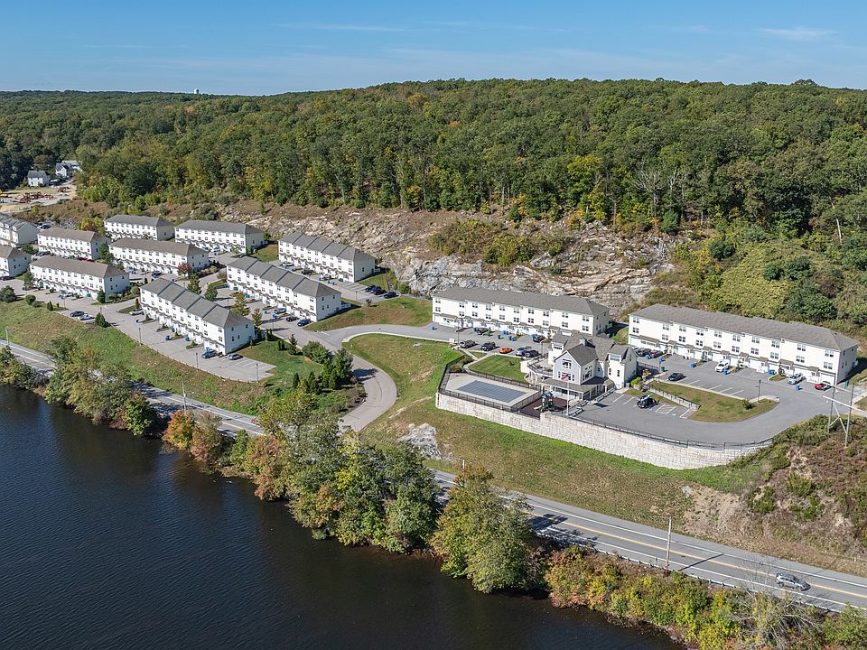 Two and three-bedroom townhouse apartments with garages and private patios.