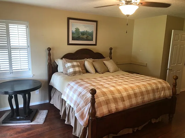 Master bedroom with french doors to backyard deck