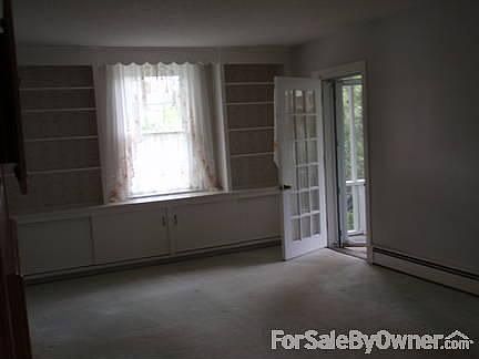 Living Room
						:
						Glass Door that leads into the newly renovated screened in porch