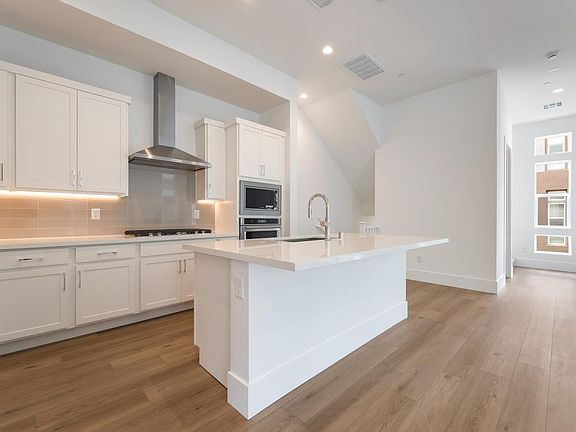 Beautifully upgraded kitchen with custom backsplash