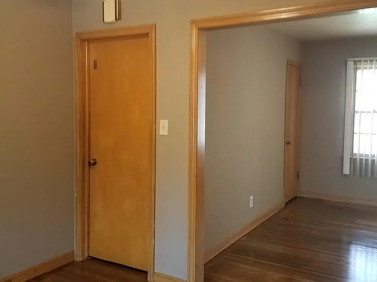 Dining Room looking into Living Room and Door to Garage and Basement