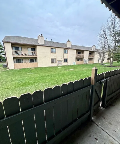 Patio with gate to green space