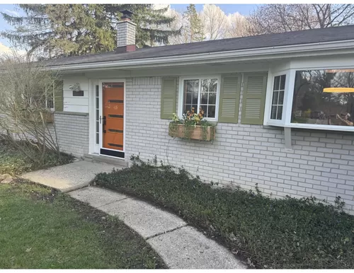 Front of House. Brand new front door and window boxes. - 1857 Ansal Dr