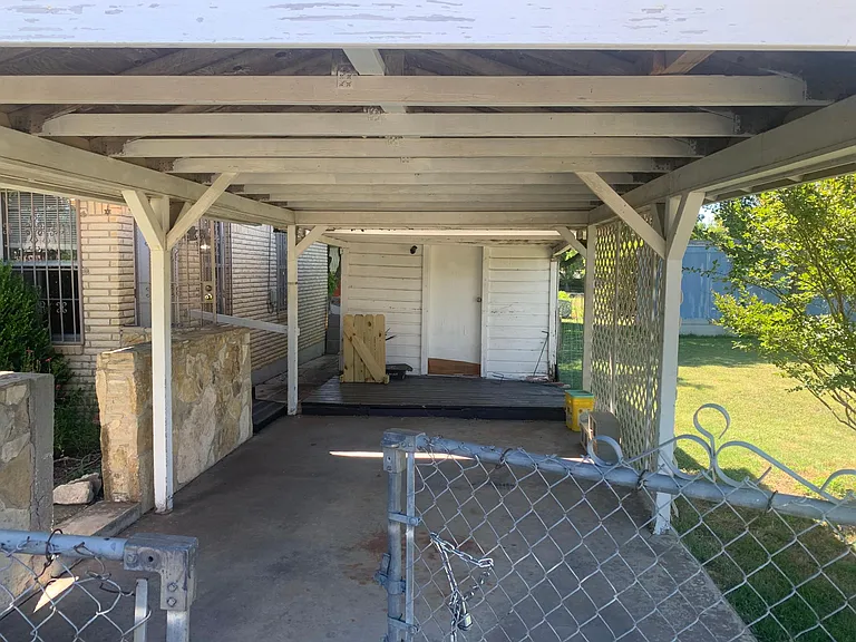 Carport attached to shed.