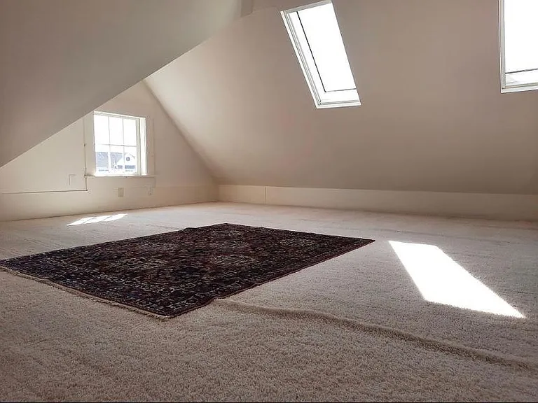 Fully finished Attic loft with skylights. Great for extra family room, exercise room or even a bedroom.