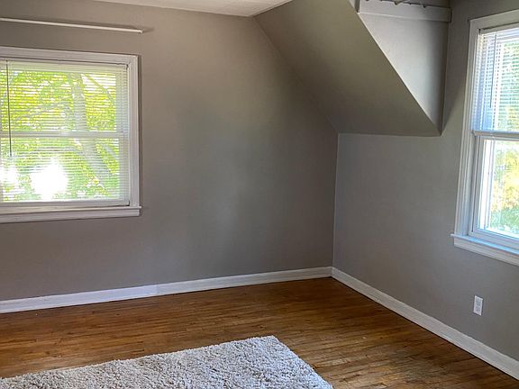 sunny living room with hardwood floor
