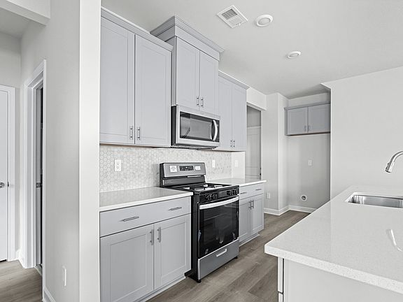 The well-appointed kitchen features plenty of counter space to make meal prep a breeze.
