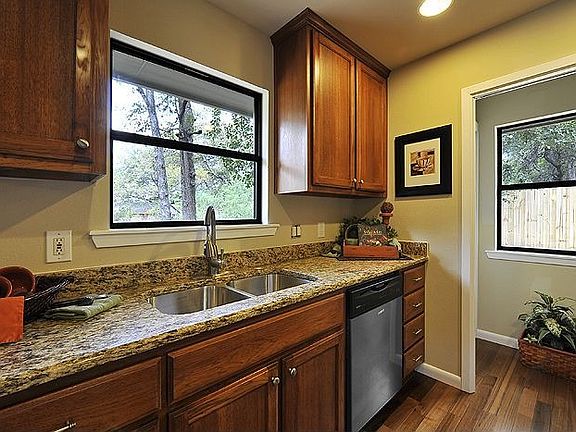 Kitchen window overlooks the spacious backyard,