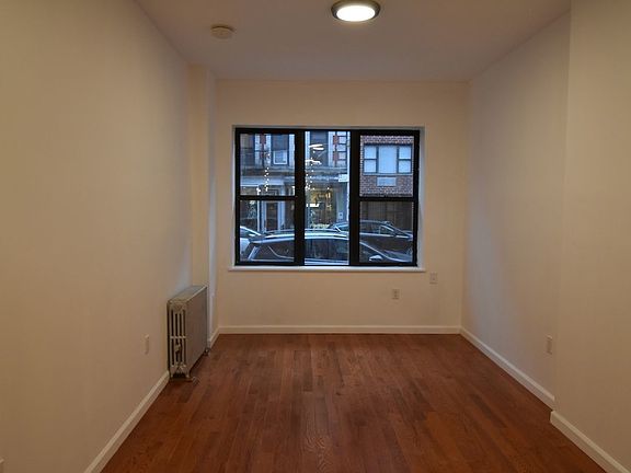5th image of 319 E 9th St APT 1