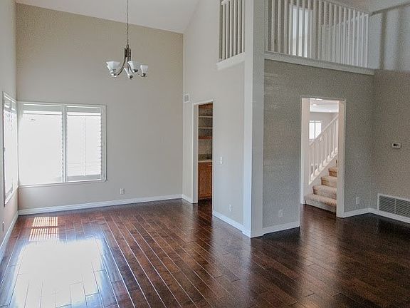 Living room looking toward the stairs and second story balcony