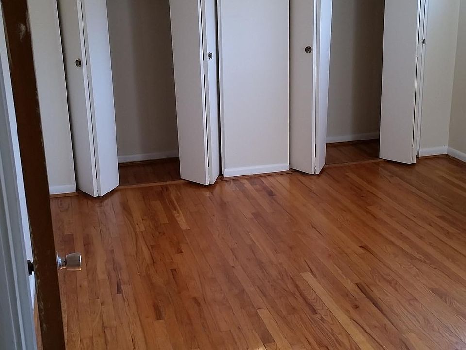 Master bedroom with ceiling fan and large, double closets.