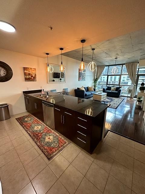 Perfect condo to relax, cook with this huge kitchen island and open living room