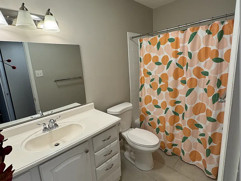 Tile and dual vanities in newer bathroom